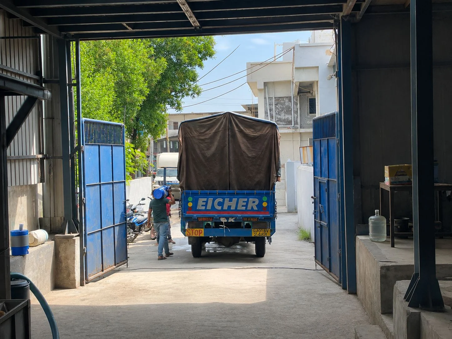 Truck leaving the Goldtap factory with lubricant dispatch in Changodar, Ahmedabad