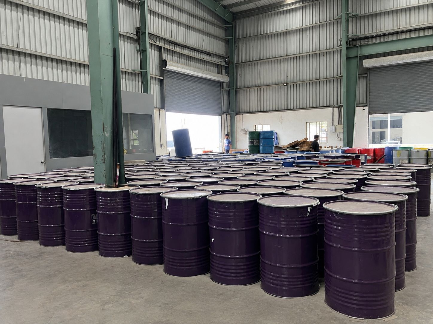 Rows of drums and barrels stored inside the Goldtap production facility